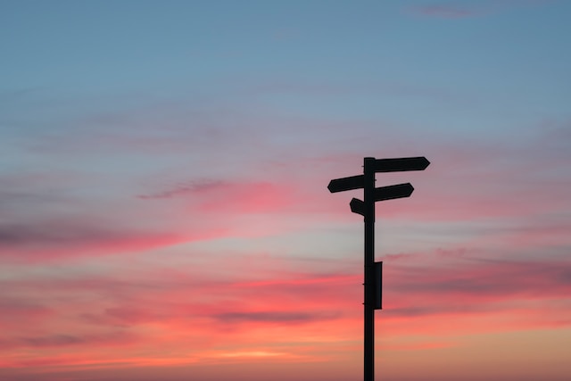 manifesting generator mastery - signpost to guide you forwards with sunset sky
