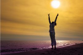 Woman cheering in the sunshine